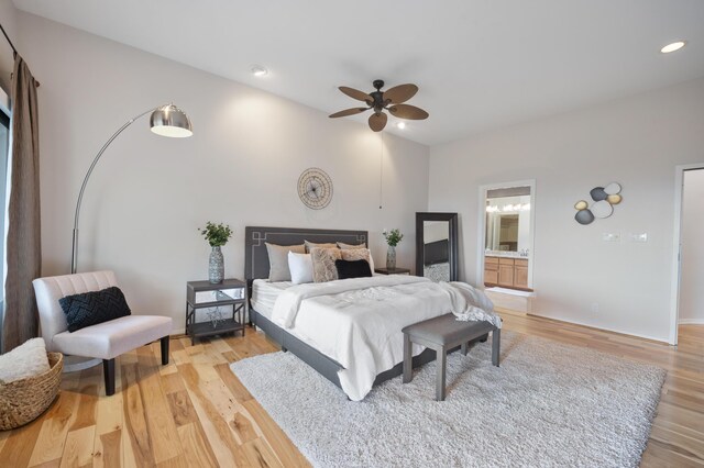 bedroom featuring ceiling fan, wood-type flooring, and ensuite bathroom