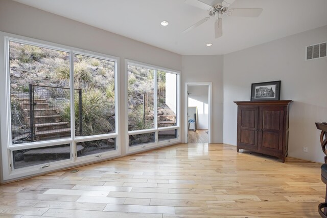 unfurnished room with light hardwood / wood-style flooring and ceiling fan