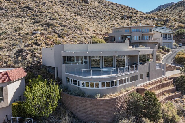 rear view of house with a mountain view