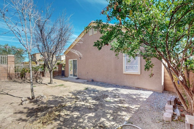 back of property featuring a patio