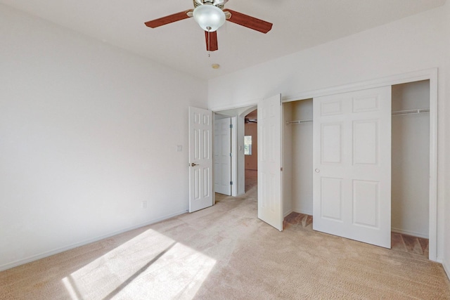 unfurnished bedroom with light colored carpet and ceiling fan