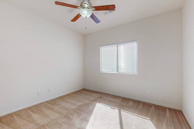 carpeted empty room with ceiling fan