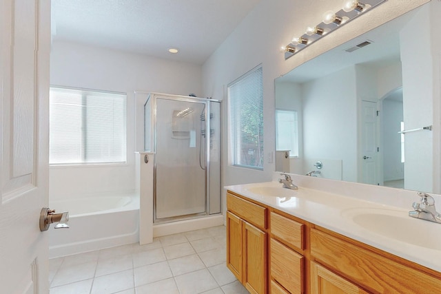 bathroom with vanity, plus walk in shower, and tile patterned floors