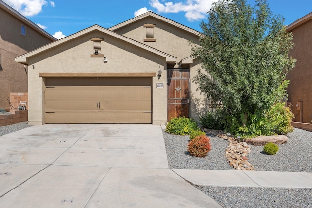 single story home featuring a garage