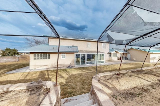 rear view of house featuring a patio area