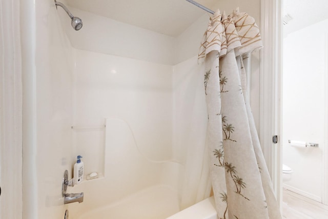 bathroom featuring shower / tub combo with curtain