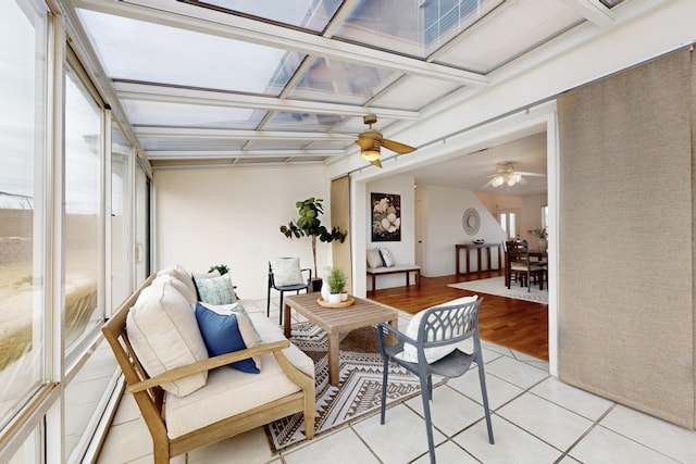 sunroom featuring ceiling fan