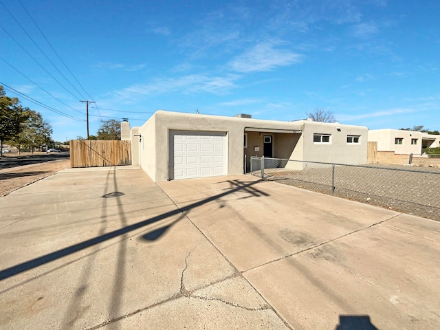 adobe home featuring a garage