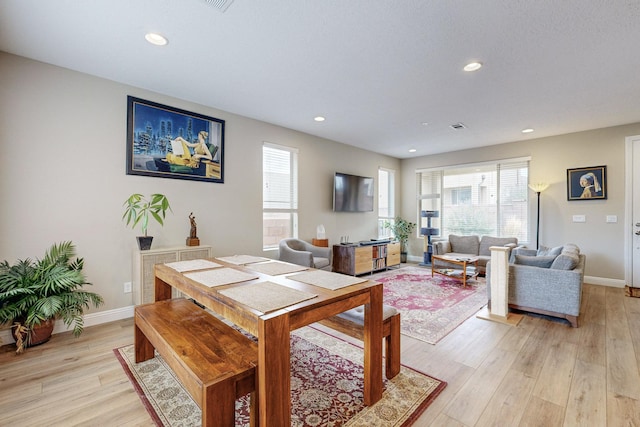 dining space featuring light hardwood / wood-style flooring