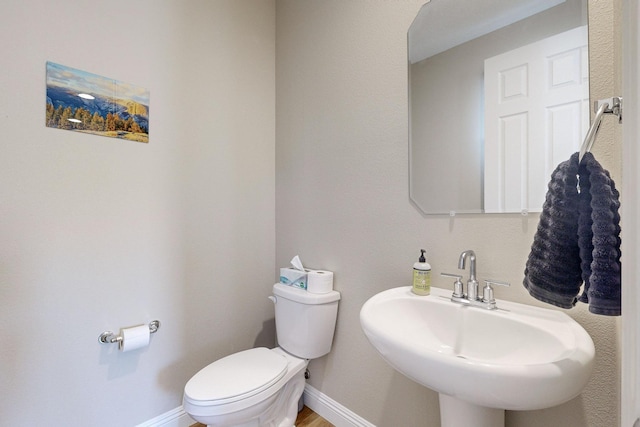 bathroom with toilet and sink