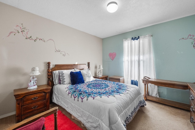 bedroom with carpet floors and a textured ceiling