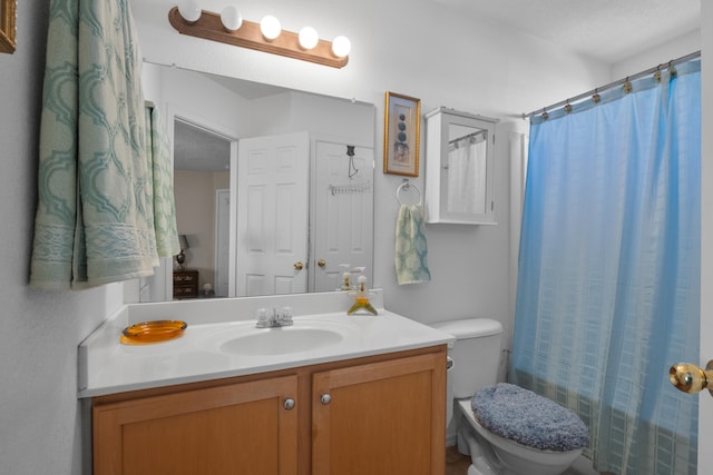 full bathroom with vanity, a textured ceiling, toilet, and shower / tub combo with curtain