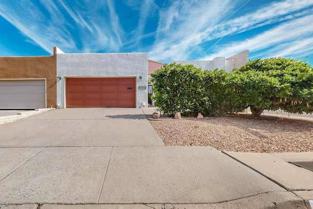 southwest-style home featuring a garage