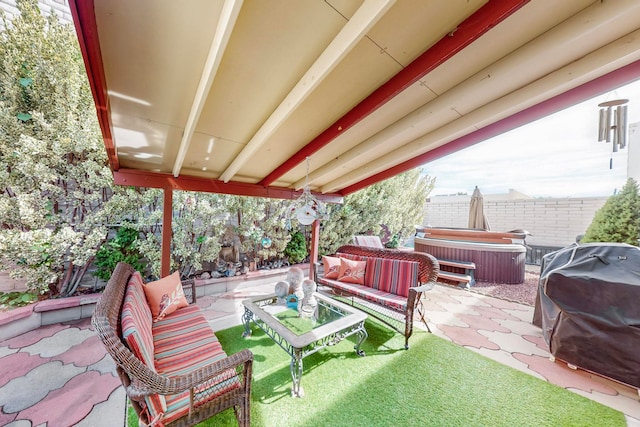 view of patio / terrace featuring a hot tub, grilling area, and an outdoor living space