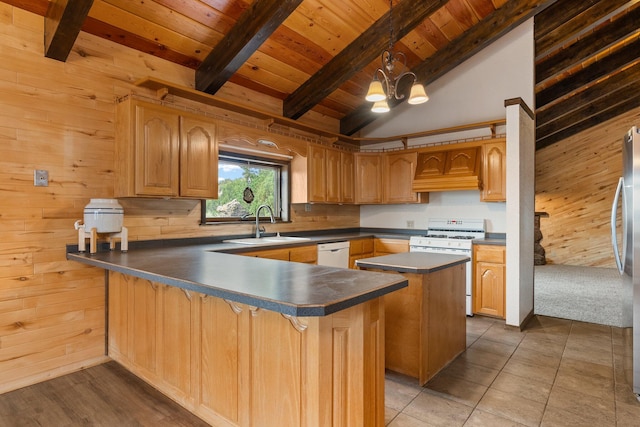 kitchen with tile patterned flooring, wooden walls, beamed ceiling, a kitchen island, and white appliances