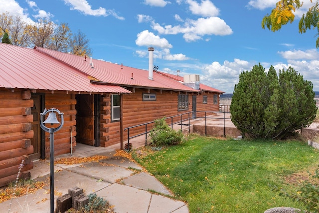 view of property exterior featuring a yard