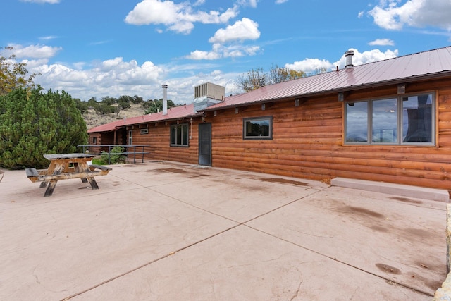 back of house with a patio