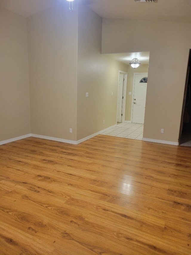 spare room featuring light wood-type flooring