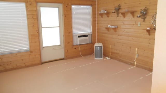 doorway with cooling unit and wooden walls