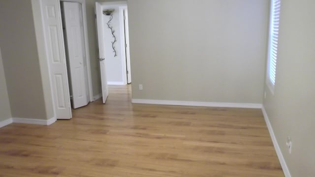 spare room with light wood-type flooring