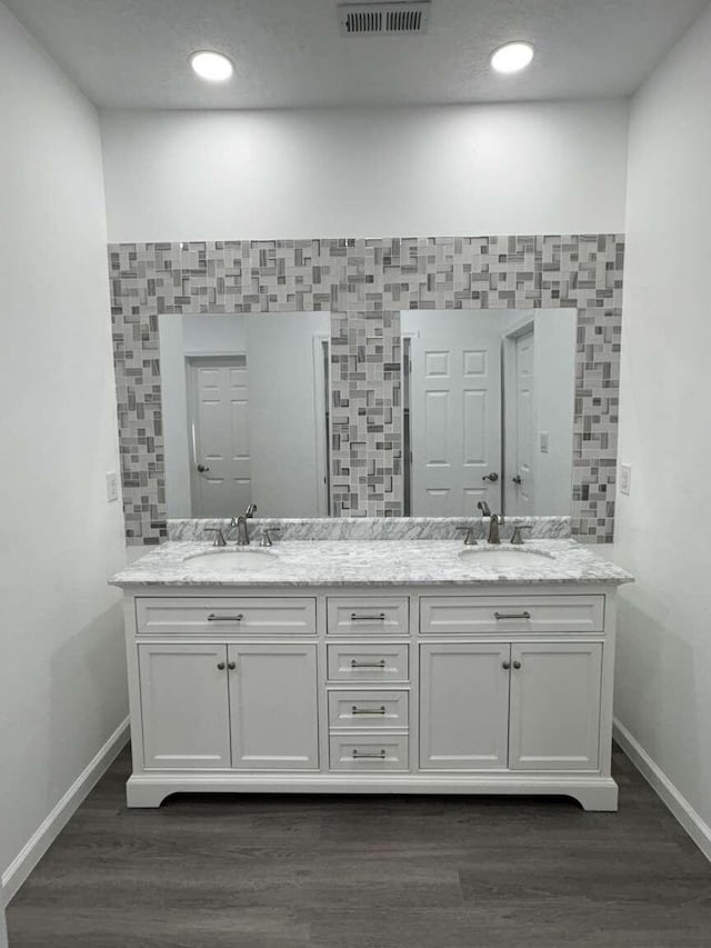 bathroom featuring vanity and hardwood / wood-style flooring