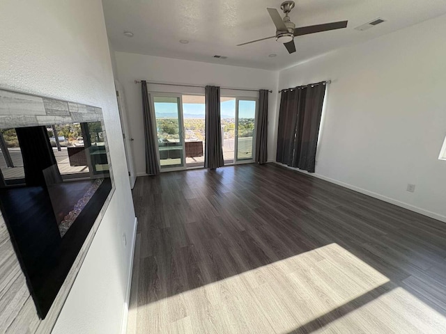 spare room with ceiling fan and hardwood / wood-style flooring