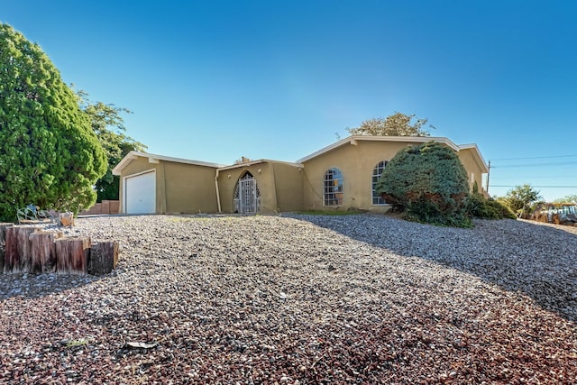 ranch-style home with a garage