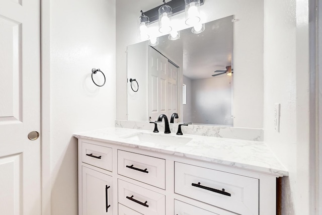 bathroom with ceiling fan and vanity