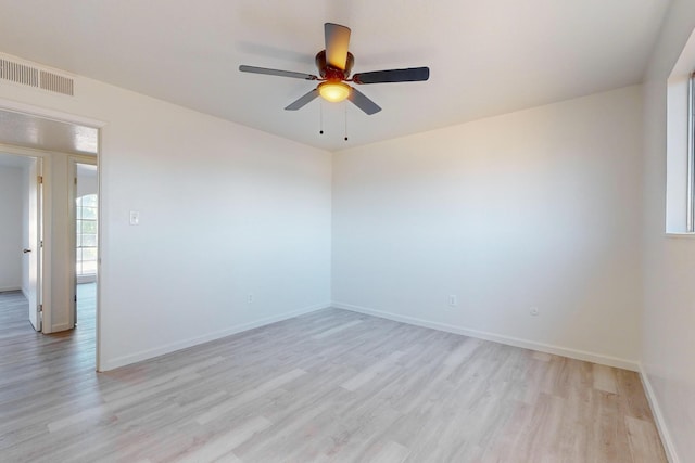 spare room with ceiling fan and light hardwood / wood-style floors