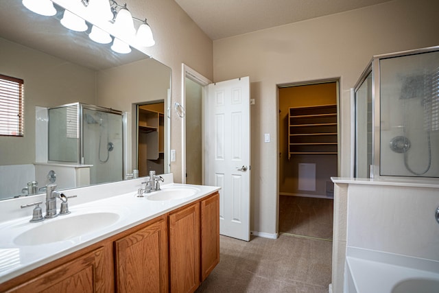 bathroom with vanity and separate shower and tub