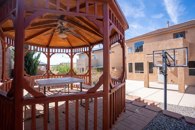 wooden deck featuring a gazebo, a patio area, and ceiling fan