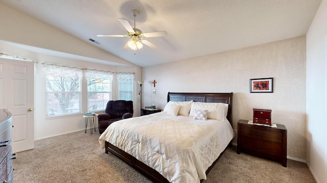 bedroom with lofted ceiling, light carpet, and ceiling fan