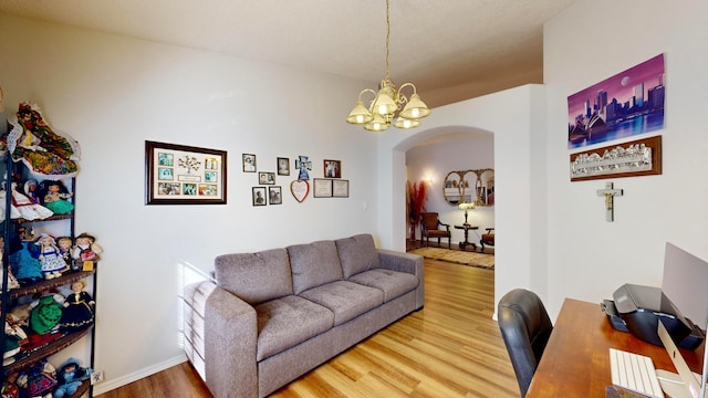 living room featuring hardwood / wood-style flooring and a chandelier