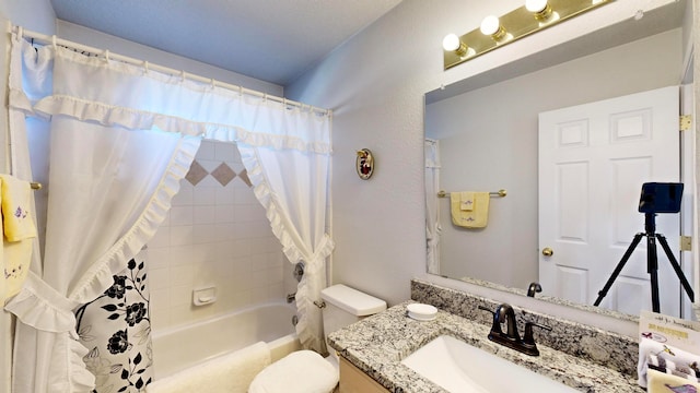 full bathroom featuring vanity, toilet, and shower / bath combination with curtain