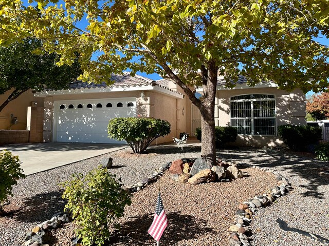 single story home featuring a garage