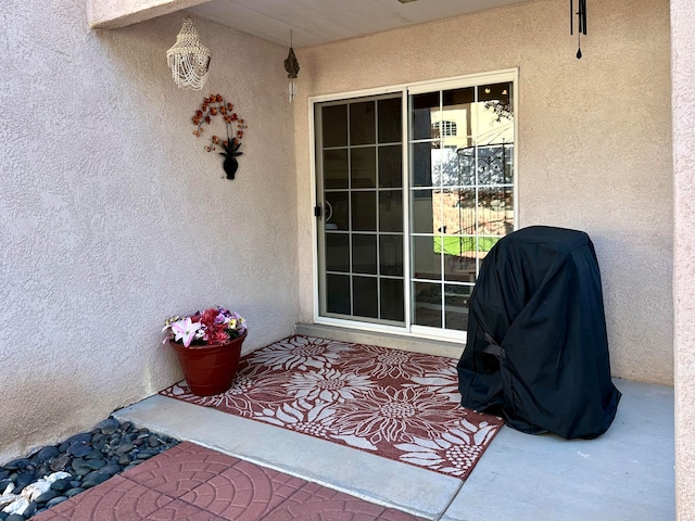 doorway to property featuring a patio area