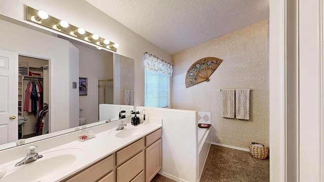 full bathroom with vanity, plus walk in shower, a textured ceiling, and toilet