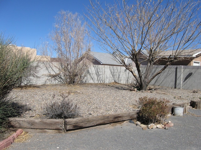 view of side of home with fence