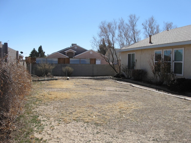 view of yard with fence