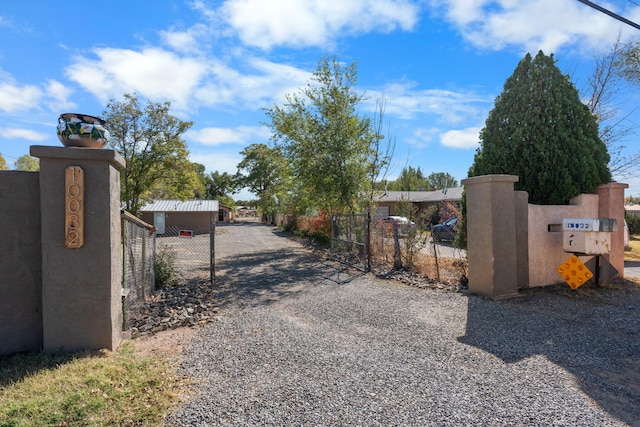 view of gate with fence