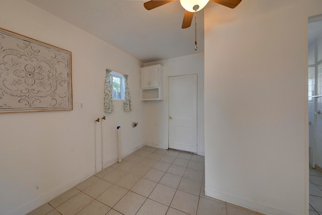 interior space featuring light tile patterned flooring and ceiling fan