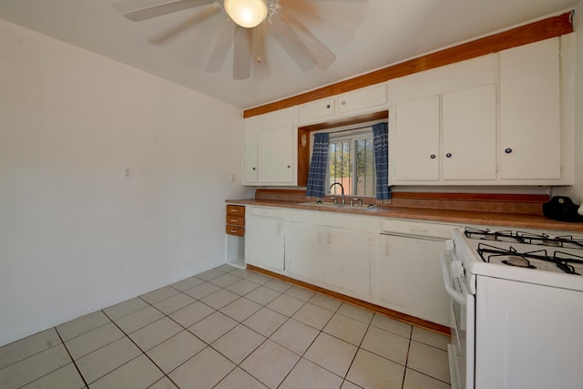 kitchen featuring white cabinets, ceiling fan, light tile patterned floors, white range oven, and sink