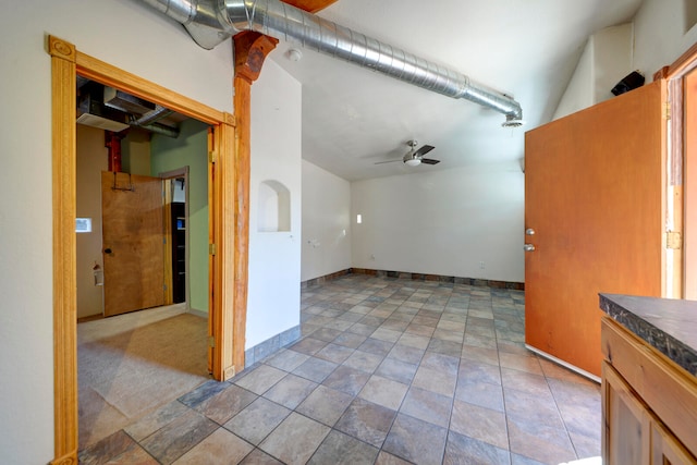 interior space featuring ceiling fan