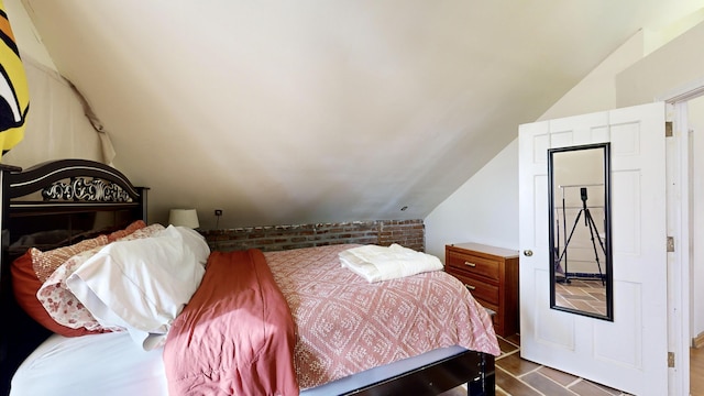 bedroom with lofted ceiling