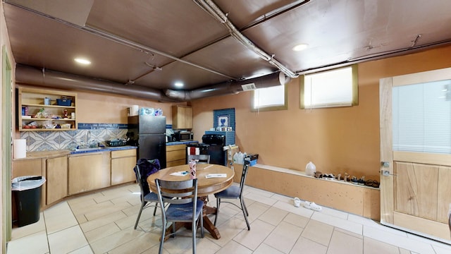 dining room with light tile patterned flooring