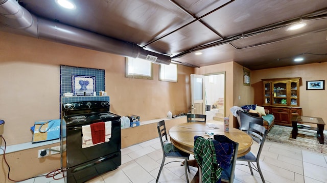 dining space featuring light tile patterned floors