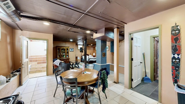 dining room featuring visible vents, decorative columns, and light tile patterned floors