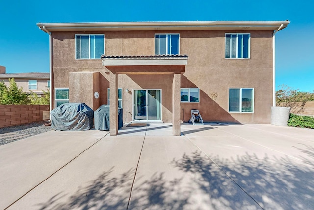 rear view of property featuring a patio