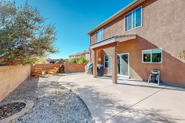 back of property featuring a patio