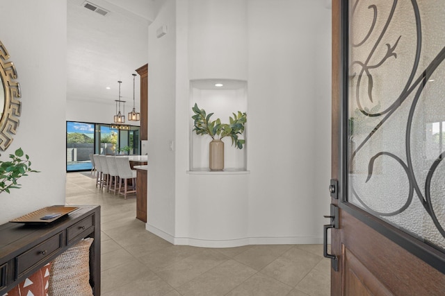 entrance foyer featuring an inviting chandelier